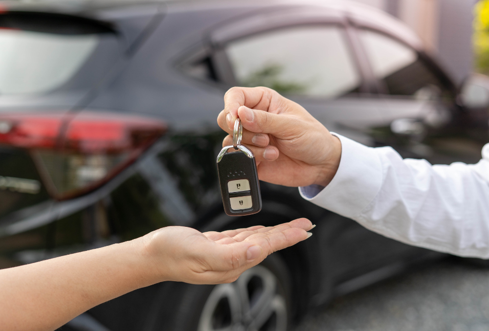 Skilled auto locksmith in Springfield, MO programming a transponder key for a high-tech car, ensuring compatibility with the vehicle's security system.